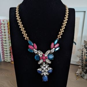 Statement fashion necklace on gold chain